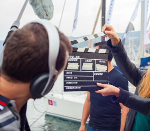 Girl holding clapperboard